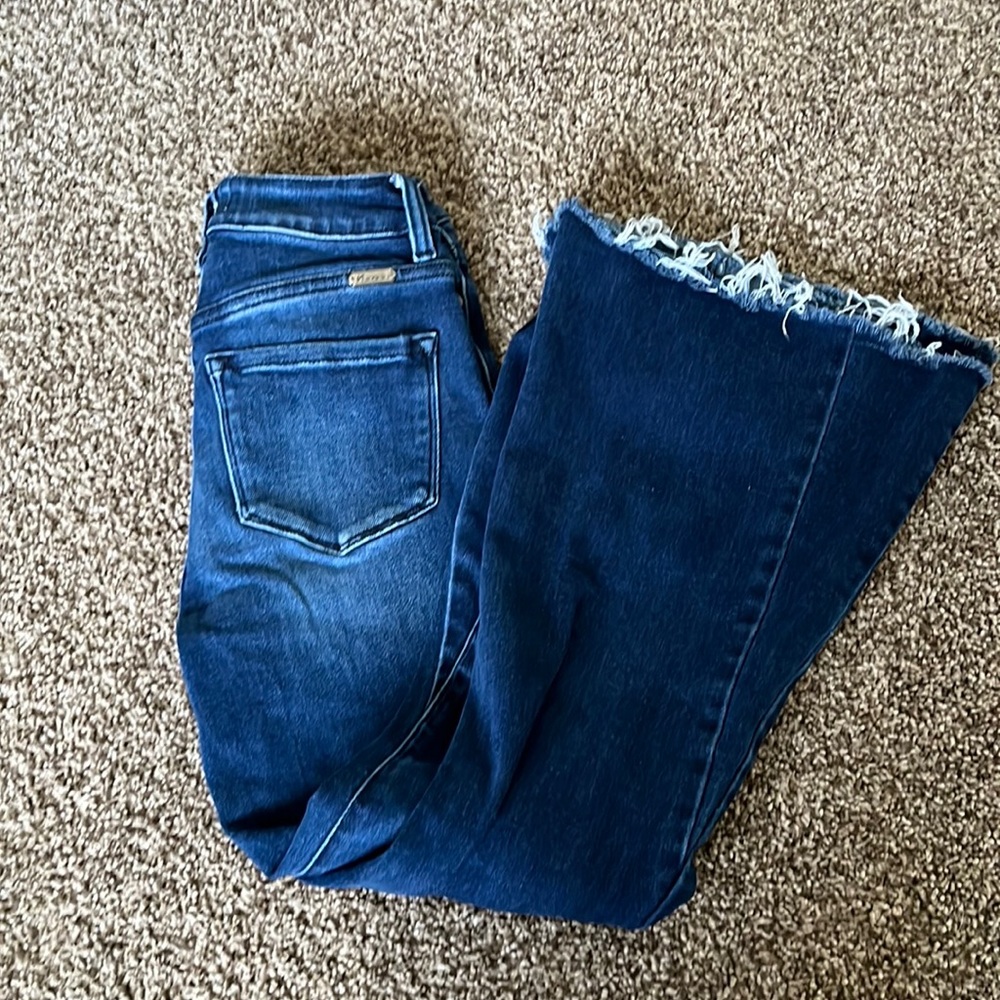 Kancan jeans with extra wide, distressed bottoms